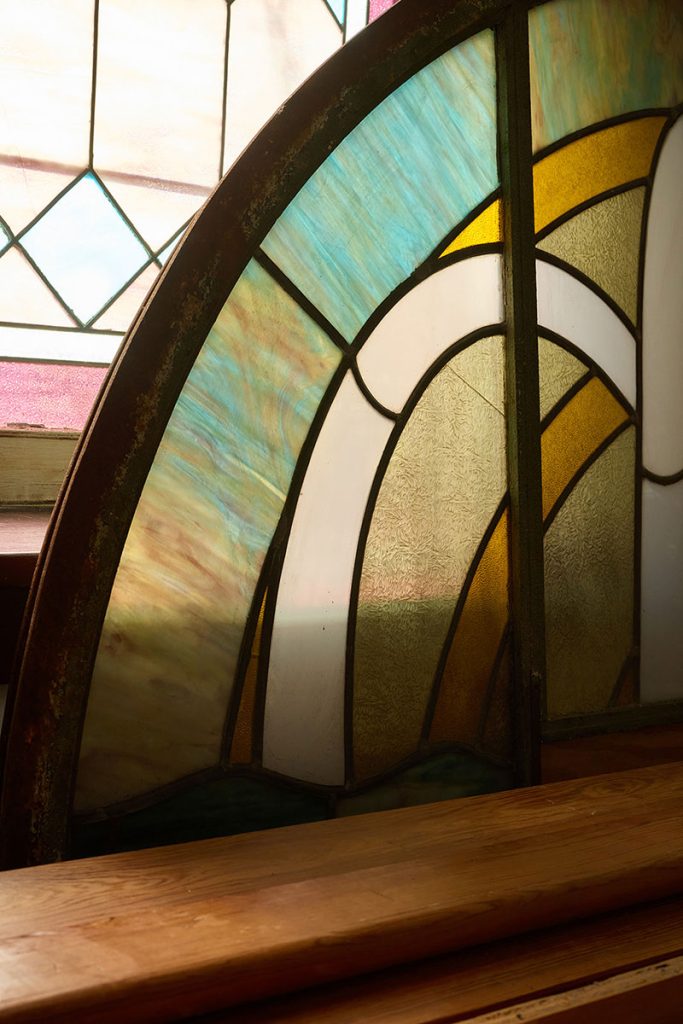 Vintage stained glass window showcasing historic architectural detail