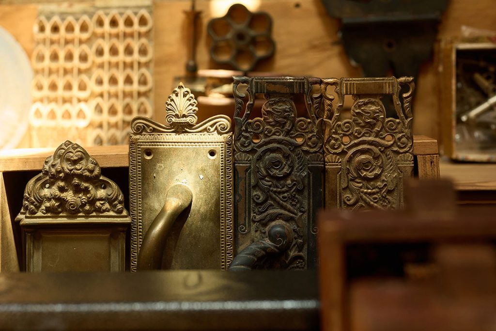 Assorted antique door hardware and salvaged architectural pieces