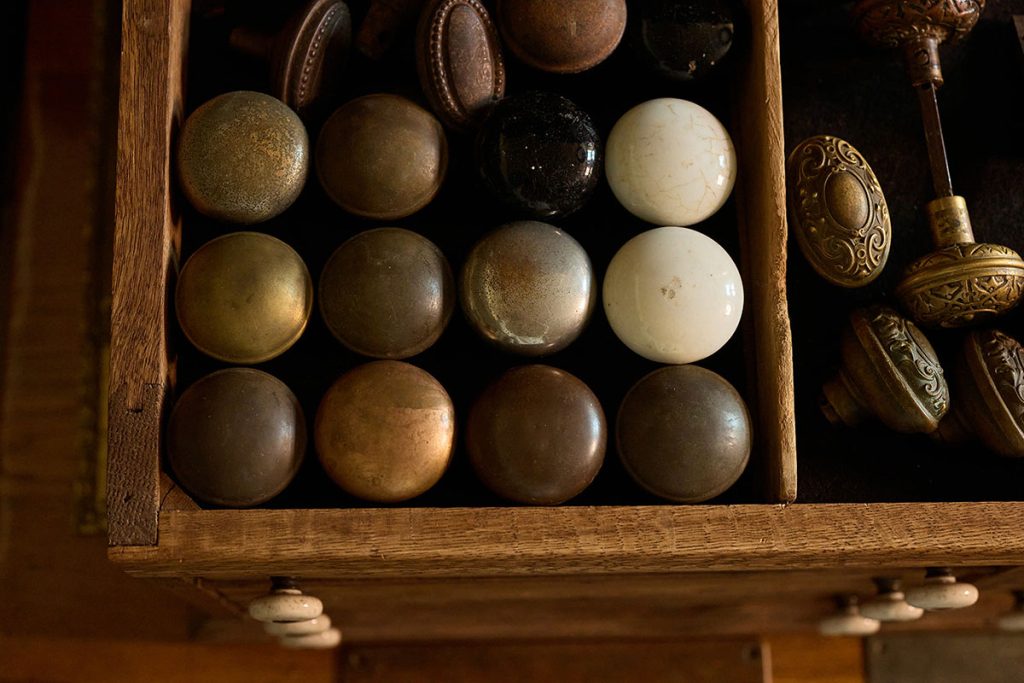 Collection of vintage doorknobs showcasing unique salvaged pieces for shoppers